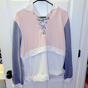 A pink/ white hoodie
